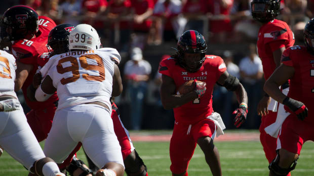 Texas Tech's running back SaRodorick Thompson (4), center, runs with the ball against Texas, Saturday, Sept. 24, 2022, at Jones AT&T Stadium.
